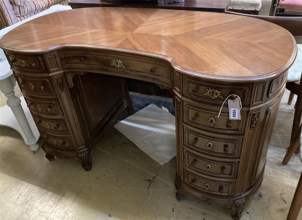 A French walnut kneehole dressing table, width 130cm, depth 58cm, height 78cm